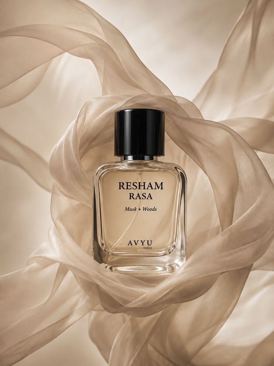 Resham Rasa perfume framed by flowing warm neutral fabric